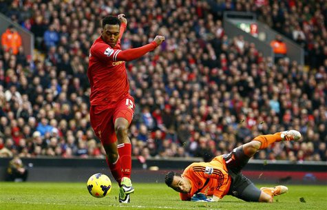 Liverpool's Daniel Sturridge (L) scores past Swansea's Michel Vorm during their English Premier League soccer match at Anfield in Liverpool, Liverpool's Daniel Sturridge (L) scores past Swansea's Michel Vorm during their English Premier League soccer match at Anfield in Liverpool,