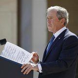 Former U.S. President George W. Bush delivers remarks with some hand-written notes during the dedication ceremony of the George W. Bush Pres Former U.S. President George W. Bush delivers remarks with some hand-written notes during the dedication ceremony of the George W. Bush Pres