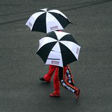 Feb 23, 2014; Daytona Beach, FL, USA; NASCAR Sprint Cup Series driver Jamie McMurray (1) walks under an umbrella during a rain delay during Feb 23, 2014; Daytona Beach, FL, USA; NASCAR Sprint Cup Series driver Jamie McMurray (1) walks under an umbrella during a rain delay during
