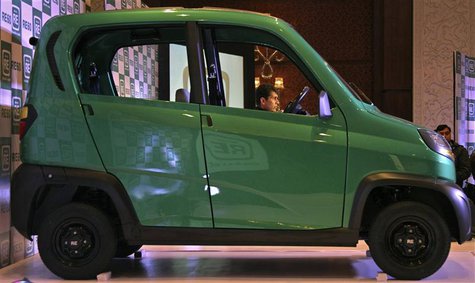 Bajaj's Managing Director Rajiv Bajaj is seen through the windows of the newly launched four-wheeled RE60 in New Delhi in this January 3, 20 Bajaj's Managing Director Rajiv Bajaj is seen through the windows of the newly launched four-wheeled RE60 in New Delhi in this January 3, 20