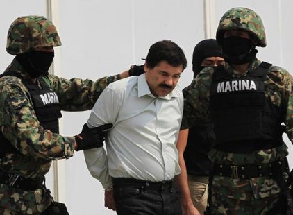 Joaquin ''Shorty'' Guzman (C) is escorted by soldiers during a presentation at the Navy's airstrip in Mexico City February 22, 2014. Credit: Reuters/Henry Romero Joaquin ''Shorty'' Guzman (C) is escorted by soldiers during a presentation at the Navy's airstrip in Mexico City February 22, 2014. Credit: Reuters/Henry Romero