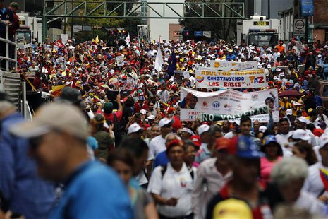 Elderly protesters take part in a march for peace in downtown Caracas February 23, 2014. REUTERS/Tomas Bravo Elderly protesters take part in a march for peace in downtown Caracas February 23, 2014. REUTERS/Tomas Bravo