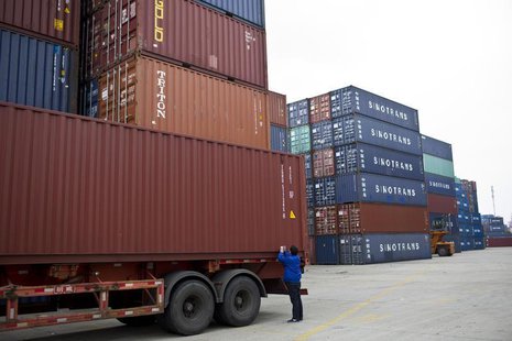 An employee takes notes at a port of Shanghai Free Trade Zone, February 11, 2014. REUTERS/Aly Song An employee takes notes at a port of Shanghai Free Trade Zone, February 11, 2014. REUTERS/Aly Song