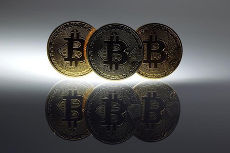 Mock Bitcoins are displayed on a table in an illustration picture taken in Berlin January 7, 2014. REUTERS/Pawel Kopczynski Mock Bitcoins are displayed on a table in an illustration picture taken in Berlin January 7, 2014. REUTERS/Pawel Kopczynski