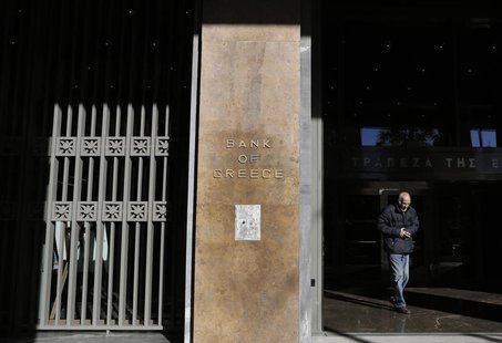 A man leaves the Bank of Greece headquarters in central Athens November 27, 2013. REUTERS/John Kolesidis A man leaves the Bank of Greece headquarters in central Athens November 27, 2013. REUTERS/John Kolesidis