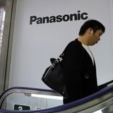 A man walks past Panasonic Corp's logos at an electronics store in Tokyo October 31, 2013. REUTERS/Toru Hanai A man walks past Panasonic Corp's logos at an electronics store in Tokyo October 31, 2013. REUTERS/Toru Hanai