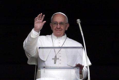 Pope Francis waves to the faithful as he appears at the window of his future private apartment in St. Peter's Square, during the Angelus pra Pope Francis waves to the faithful as he appears at the window of his future private apartment in St. Peter's Square, during the Angelus pra