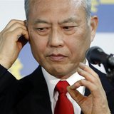 Japan's former health minister Yoichi Masuzoe checks his earphone as he prepares for an interview at his office in Tokyo February 9, 2014. R Japan's former health minister Yoichi Masuzoe checks his earphone as he prepares for an interview at his office in Tokyo February 9, 2014. R