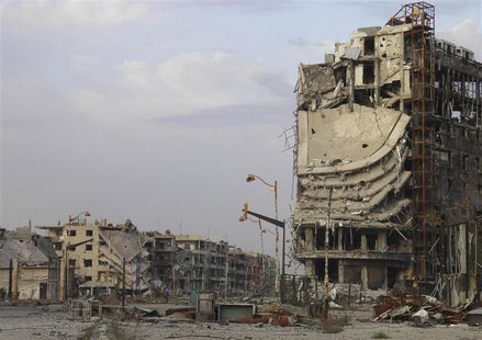Damaged buildings are pictured in the besieged area of Homs February 22, 2014. REUTERS/Thaer Al Khalidiya Damaged buildings are pictured in the besieged area of Homs February 22, 2014. REUTERS/Thaer Al Khalidiya