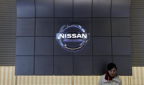 A staff stands near the logo of Nissan Motor at the company's showroom in Tokyo February 10, 2014. REUTERS/Toru Hanai A staff stands near the logo of Nissan Motor at the company's showroom in Tokyo February 10, 2014. REUTERS/Toru Hanai