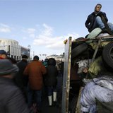 An anti-Yanukovich protester sits atop a barricade in Kiev's Independent Square February 24, 2014. REUTERS/Yannis Behrakis An anti-Yanukovich protester sits atop a barricade in Kiev's Independent Square February 24, 2014. REUTERS/Yannis Behrakis