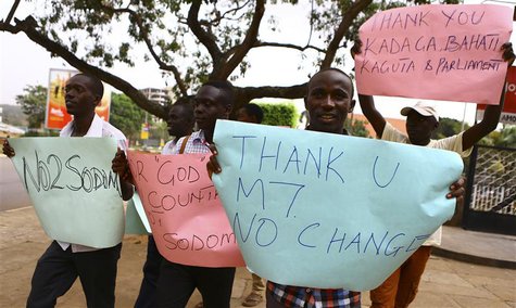 Anti-gay supporters celebrate after Uganda's President Yoweri Museveni signed a law imposing harsh penalties for homosexuality in Kampala Fe Anti-gay supporters celebrate after Uganda's President Yoweri Museveni signed a law imposing harsh penalties for homosexuality in Kampala Fe