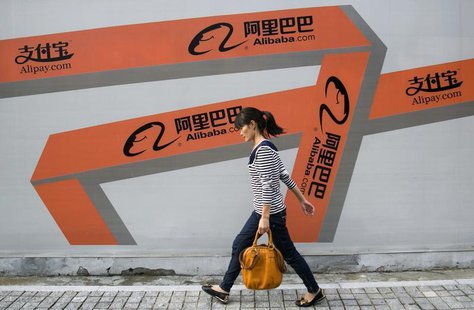 A woman walks past an Alibaba advertisement on a wall in Hangzhou, Zhejiang province September 26, 2013. REUTERS/Chance Chan A woman walks past an Alibaba advertisement on a wall in Hangzhou, Zhejiang province September 26, 2013. REUTERS/Chance Chan