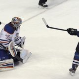 Colorado Avalanche's Milan Hejduk (R) scores the first goal in the shoot out against Edmonton Oilers' Semyon Varlamov (L) during their NHL h Colorado Avalanche's Milan Hejduk (R) scores the first goal in the shoot out against Edmonton Oilers' Semyon Varlamov (L) during their NHL h
