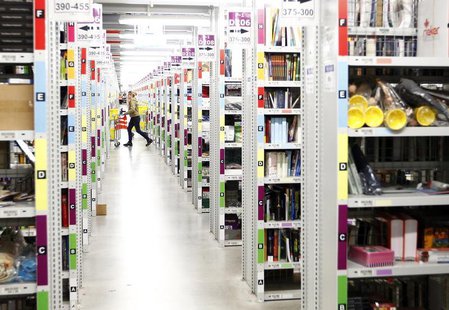 A worker collects items to pack into boxes at Amazon's logistics centre in Graben near Augsburg December 16, 2013. REUTERS/Michaela Rehle A worker collects items to pack into boxes at Amazon's logistics centre in Graben near Augsburg December 16, 2013. REUTERS/Michaela Rehle