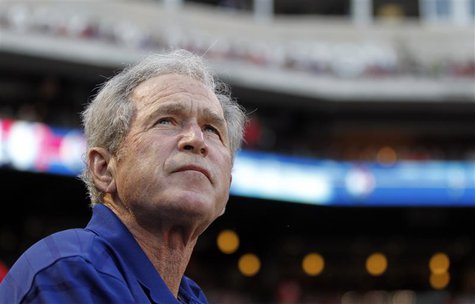 Former U.S. president George W. Bush watches before the start of the MLB American League baseball game between the Texas Rangers and the Chi Former U.S. president George W. Bush watches before the start of the MLB American League baseball game between the Texas Rangers and the Chi
