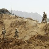 U.S. troops investigate the site of a suicide attack on a NATO base in Zhari, west of Kandahar province, January 20, 2014. REUTERS/Ahmad Nad U.S. troops investigate the site of a suicide attack on a NATO base in Zhari, west of Kandahar province, January 20, 2014. REUTERS/Ahmad Nad