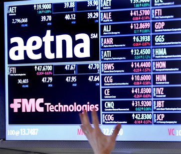 A trader points up at a display on the floor of the New York Stock Exchange August 20, 2012. REUTERS/Brendan McDermid A trader points up at a display on the floor of the New York Stock Exchange August 20, 2012. REUTERS/Brendan McDermid
