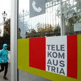 A jogger runs by a Telekom Austria phone booth in Vienna November 14, 2013. REUTERS/Heinz-Peter Bader A jogger runs by a Telekom Austria phone booth in Vienna November 14, 2013. REUTERS/Heinz-Peter Bader