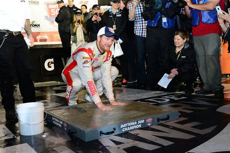 NASCAR Sprint Cup driver Dale Earnhardt Jr (88) inshrines his hands in cement after winning the Daytona 500 at Daytona International Speedwa NASCAR Sprint Cup driver Dale Earnhardt Jr (88) inshrines his hands in cement after winning the Daytona 500 at Daytona International Speedwa