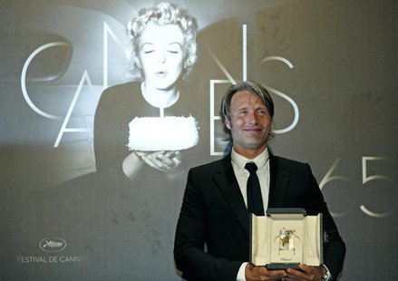 Best Actor award winner Mads Mikkelsen for the film "Jagten" (The Hunt) poses during a photocall after the awards ceremony of the 65th Canne Best Actor award winner Mads Mikkelsen for the film "Jagten" (The Hunt) poses during a photocall after the awards ceremony of the 65th Canne