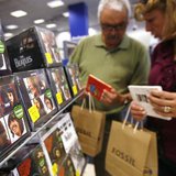 Customers browse Beatles collections during their launch in New York, September 9, 2009. REUTERS/Shannon Stapleton Customers browse Beatles collections during their launch in New York, September 9, 2009. REUTERS/Shannon Stapleton