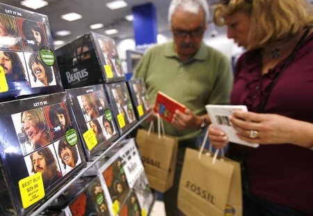Customers browse Beatles collections during their launch in New York, September 9, 2009. REUTERS/Shannon Stapleton Customers browse Beatles collections during their launch in New York, September 9, 2009. REUTERS/Shannon Stapleton