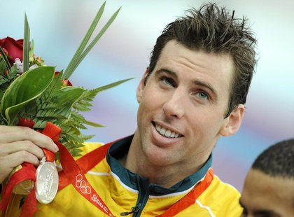 Grant Hackett of Australia holds his silver medal for the men's 1500m freestyle swimming final at the National Aquatics Center during the Be Grant Hackett of Australia holds his silver medal for the men's 1500m freestyle swimming final at the National Aquatics Center during the Be