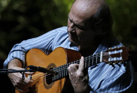 Spanish flamenco guitarist Paco de Lucia plays a guitar during a rehearsal of closing concert of the Biennial of Flamenco in the Andalusian Spanish flamenco guitarist Paco de Lucia plays a guitar during a rehearsal of closing concert of the Biennial of Flamenco in the Andalusian