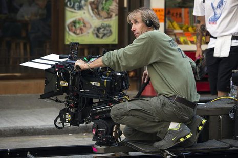 U.S director and producer Michael Bay holds a camera during the filming of a scene for the movie "Transformers: Age of Extinction" in Hong K U.S director and producer Michael Bay holds a camera during the filming of a scene for the movie "Transformers: Age of Extinction" in Hong K