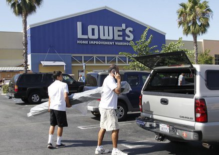 People load a roll of carpet into a vehicle at the Lowe's Home Improvement Warehouse in Burbank, California August 15, 2011. REUTERS/Fred Pr People load a roll of carpet into a vehicle at the Lowe's Home Improvement Warehouse in Burbank, California August 15, 2011. REUTERS/Fred Pr