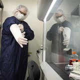 Derek Grice pulls additional sterilized covers on his arms in a Northwest Biotherapeutics laboratory in Memphis, Tennessee, February 21, 201 Derek Grice pulls additional sterilized covers on his arms in a Northwest Biotherapeutics laboratory in Memphis, Tennessee, February 21, 201