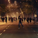 Anti-government demonstrators run from tear gas during clashes with riot police at Altamira Square in Caracas February 24, 2014. REUTERS/Car Anti-government demonstrators run from tear gas during clashes with riot police at Altamira Square in Caracas February 24, 2014. REUTERS/Car