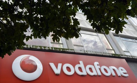 Vodafone branding is seen outside a retail store in London November 12, 2013. REUTERS/Toby Melville Vodafone branding is seen outside a retail store in London November 12, 2013. REUTERS/Toby Melville