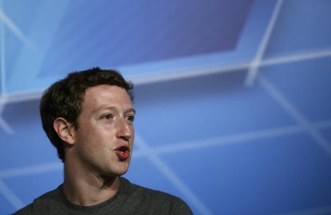 Facebook Chief Executive Officer Mark Zuckerberg smiles in the stage before delivering a keynote speech during the Mobile World Congress in Facebook Chief Executive Officer Mark Zuckerberg smiles in the stage before delivering a keynote speech during the Mobile World Congress in