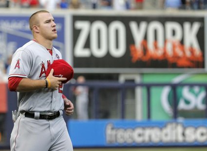 Los Angeles Angels center fielder Mike Trout runs past an outfield sign before playing the New York Yankees in their MLB American League gam Los Angeles Angels center fielder Mike Trout runs past an outfield sign before playing the New York Yankees in their MLB American League gam