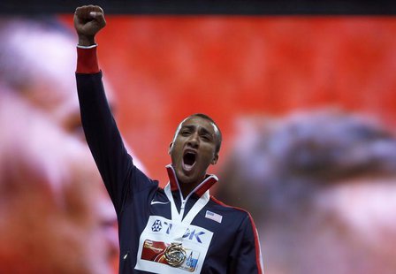 Gold medallist Ashton Eaton of the U.S. celebrates during the award ceremony for the men's decathlon during the IAAF World Athletics Champio Gold medallist Ashton Eaton of the U.S. celebrates during the award ceremony for the men's decathlon during the IAAF World Athletics Champio