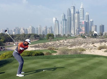 Tiger Woods of the U.S.takes a shot on the 8th tee during the third round of the 2014 Omega Dubai Desert Classic in Dubai February 1, 2014. Tiger Woods of the U.S.takes a shot on the 8th tee during the third round of the 2014 Omega Dubai Desert Classic in Dubai February 1, 2014.