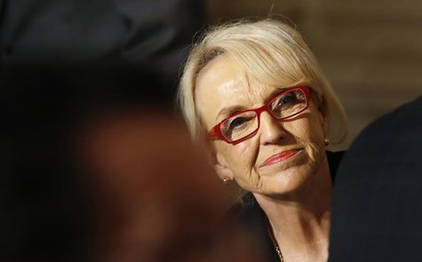 Arizona Governor Jan Brewer looks up as U.S. President Barack Obama addresses the National Governors Association in the State Dining Room of Arizona Governor Jan Brewer looks up as U.S. President Barack Obama addresses the National Governors Association in the State Dining Room of