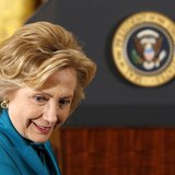 Former first lady Hillary Clinton sits down before the Presidential Medal of Freedom ceremony in the East Room of the White House in Washing Former first lady Hillary Clinton sits down before the Presidential Medal of Freedom ceremony in the East Room of the White House in Washing