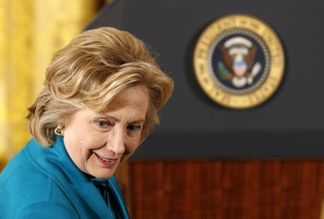 Former first lady Hillary Clinton sits down before the Presidential Medal of Freedom ceremony in the East Room of the White House in Washing Former first lady Hillary Clinton sits down before the Presidential Medal of Freedom ceremony in the East Room of the White House in Washing
