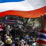 Anti-government protesters gather outside the Royal Thai Police headquarters as anti-government protest leader Suthep Thaugsuban (C, on vehi Anti-government protesters gather outside the Royal Thai Police headquarters as anti-government protest leader Suthep Thaugsuban (C, on vehi