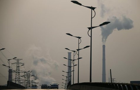 Smoke rises from chimneys of a steel plant next to a viaduct on a hazy day in Tangshan, Hebei province February 18, 2014. REUTERS/Petar Kuju Smoke rises from chimneys of a steel plant next to a viaduct on a hazy day in Tangshan, Hebei province February 18, 2014. REUTERS/Petar Kuju