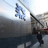 A man walks past a Royal Bank of Scotland building in central London January 28, 2014. REUTERS/Paul Hackett A man walks past a Royal Bank of Scotland building in central London January 28, 2014. REUTERS/Paul Hackett