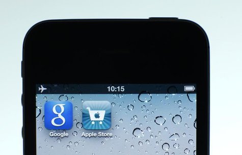 Google and Apple applications are seen on the display of IPhone in this photo illustration taken in Berlin, August 31, 2012. REUTERS/Pawel K Google and Apple applications are seen on the display of IPhone in this photo illustration taken in Berlin, August 31, 2012. REUTERS/Pawel K
