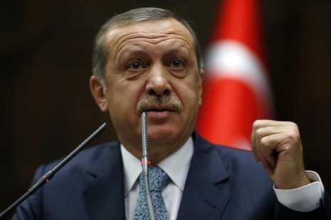 Turkey's Prime Minister Tayyip Erdogan addresses members of parliament from his ruling AK Party (AKP) during a meeting at the Turkish parlia Turkey's Prime Minister Tayyip Erdogan addresses members of parliament from his ruling AK Party (AKP) during a meeting at the Turkish parlia