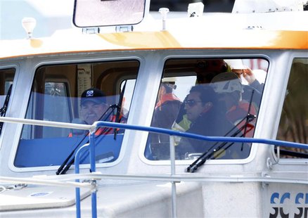 Captain Francesco Schettino (R) takes a boat ride to get to the Costa Concordia cruise liner at the Giglio harbour February 27, 2014. REUTER Captain Francesco Schettino (R) takes a boat ride to get to the Costa Concordia cruise liner at the Giglio harbour February 27, 2014. REUTER