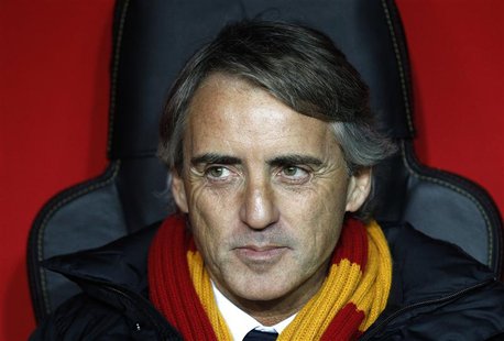 Galatasaray's coach Roberto Mancini reacts before the start of his team's Champions League soccer match against Chelsea at Turk Telekom Aren Galatasaray's coach Roberto Mancini reacts before the start of his team's Champions League soccer match against Chelsea at Turk Telekom Aren
