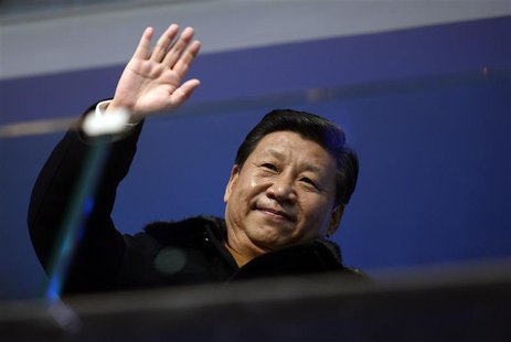 China's President Xi Jinping waves from the presidential tribune at the opening ceremony of the 2014 Winter Olympics in Sochi, February 7, 2 China's President Xi Jinping waves from the presidential tribune at the opening ceremony of the 2014 Winter Olympics in Sochi, February 7, 2