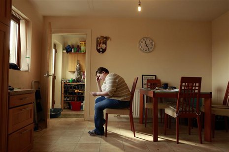 Catherine Droogan, adopted at four weeks and with no knowledge of her biological parents, looks at her birth certificate and adoption papers Catherine Droogan, adopted at four weeks and with no knowledge of her biological parents, looks at her birth certificate and adoption papers